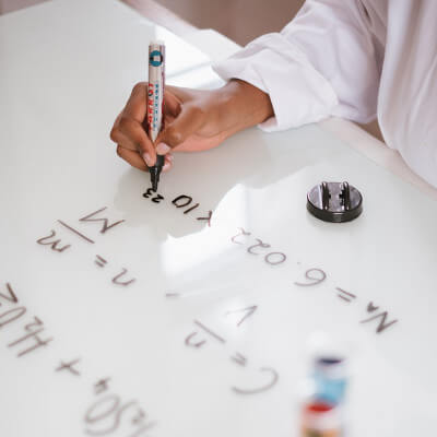 Scientists Writing Formula on White Board